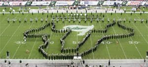 The Herd of Thunder performing before a game