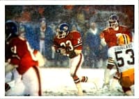 John Elway (right) hands the ball for a rushing play against the Packers in 1984.