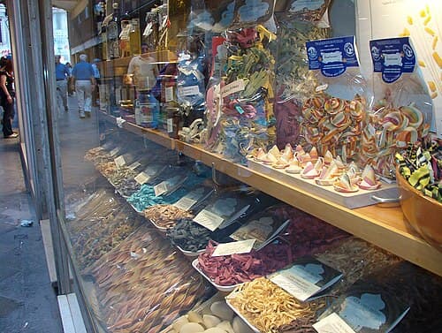 Some different colours and shapes of pasta in a pasta specialty store in Venice, Italy