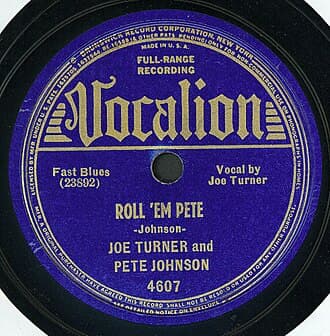 Big Joe Turner and Pete Johnson's record "Roll 'Em Pete" is regarded as a precursor to rock and roll.