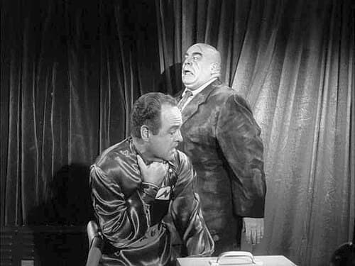 The corpse of Inspector Clay (Tor Johnson) attacks Eros (Dudley Manlove) in the 1957 Ed Wood classic Plan 9 from Outer Space.