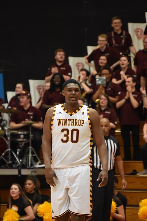 Winthrop Big Man, D. J. Burns, on the floor at the Dedmon Center during the 2020 Big South Quarter Final Game with USC-Upstate.