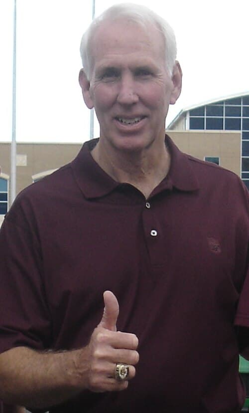 Former head coach R.C. Slocum gives a gig 'em with his Big 12 Championship ring.