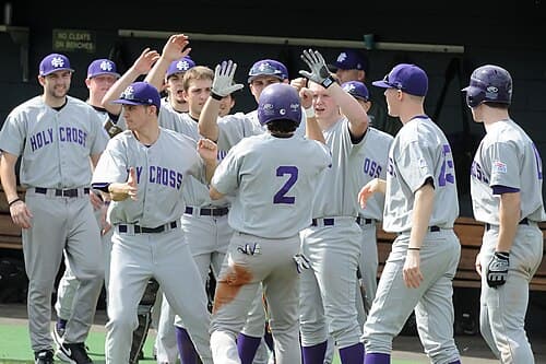 Crusaders baseball players celebrating a run in 2009