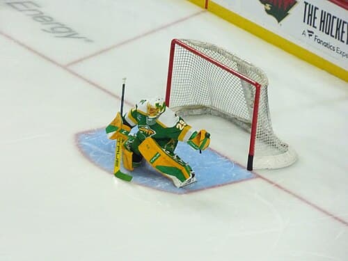 Marc-Andre Fleury wearing the green "Reverse Retro" uniform in 2022, which would become their alternate the following season.