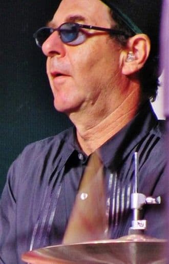 Anton Fig performed drums on Dynasty and Unmasked, and co-wrote the song "Dark Light" for Music from "The Elder".