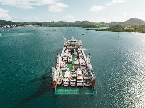 M/V Yacht Servant, with a cargo of yachts, is a purpose-built semi-submersible vessel.