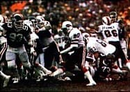 Bills' running back Joe Cribbs (middle) rushes the ball against the Jets in the 1981 AFC Wild Card.